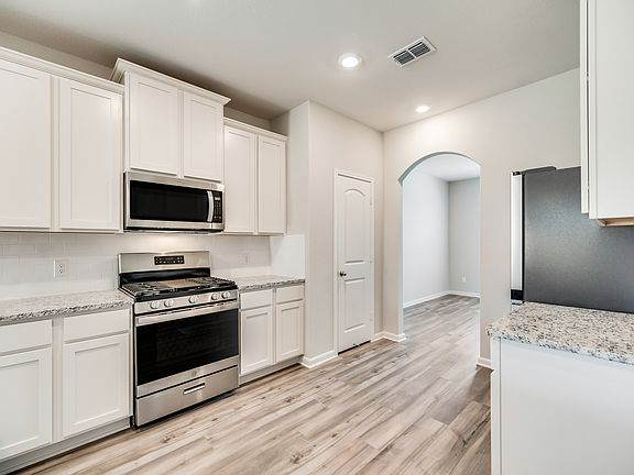 The chef-ready kitchen is open to the dining room in this popular layout.