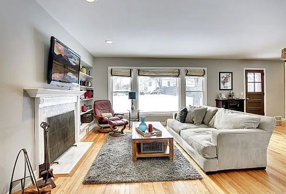 Living room with door to deck and yard