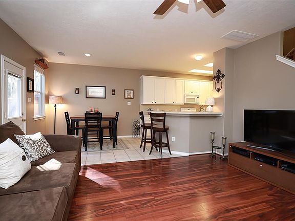 The den has laminate flooring and the other areas downstairs are tiled. The kitchen is open to the den when you are cooking or doing dishes!