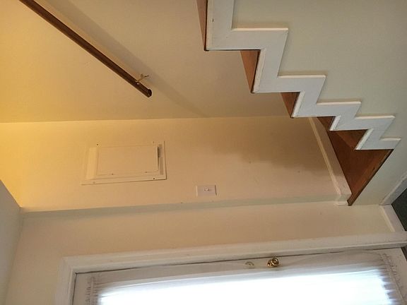 Stairs to second floor and door to patio