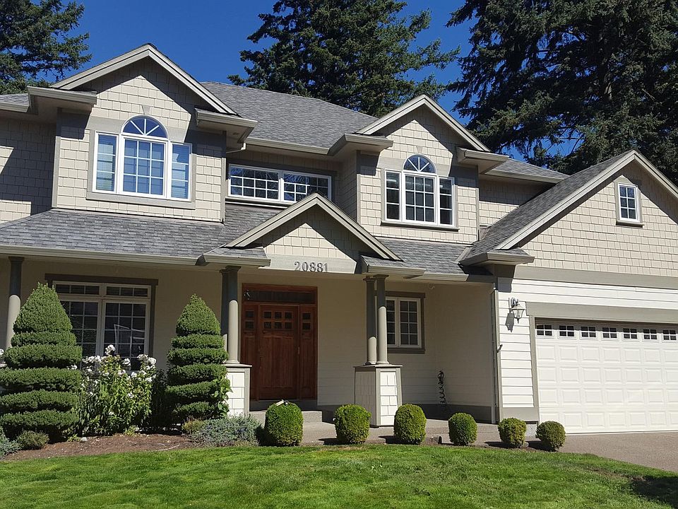 Beautiful custom home in quiet neighborhood with oversized 3 car garage with walk through to back yard from garage
