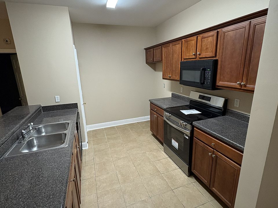 Kitchen area with brand new stainless steel stove (brand new stainless steel refrigerator on back order but will be installed).