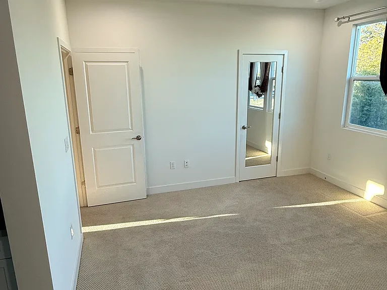 Master Bedroom from inside with walk in closet and a separate closet