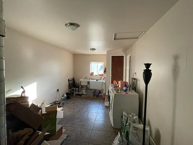 Laundry and Utility/Storage room with separate back yard entrance. AKA: "Mud Room."