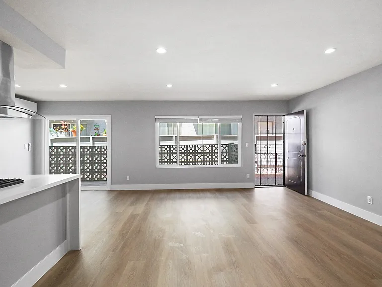 Open-Concept Kitchen, Dining, and Living Room Space with Large-Size Windows