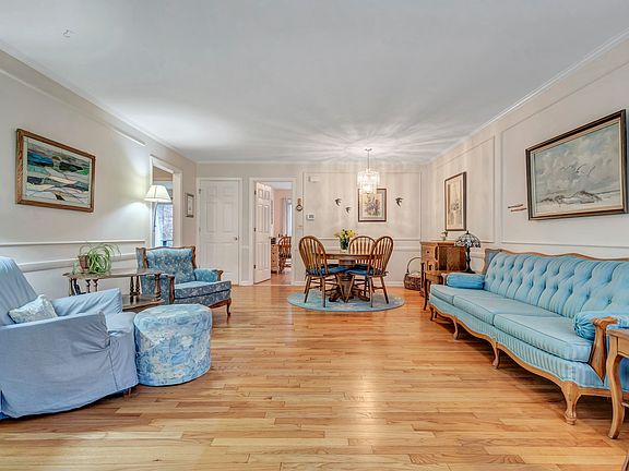 Welcoming large living & dining area. Formally appointed with chair rail and moldings.