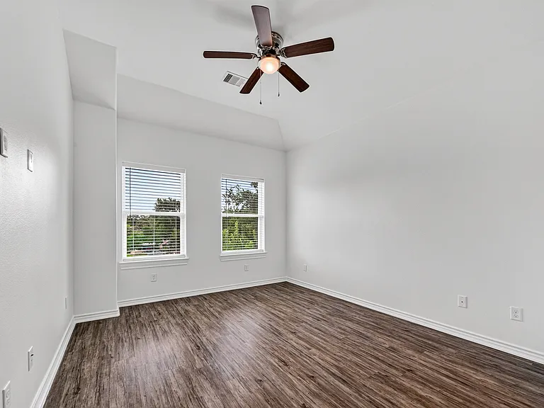 All bedrooms feature ceiling fans for added comfort.