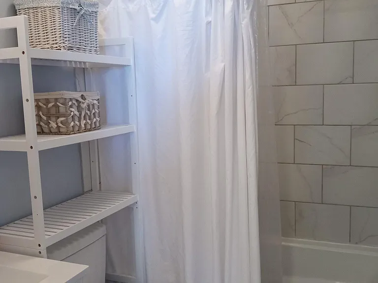 Relax in the deep soaker tub/shower with tiled walls