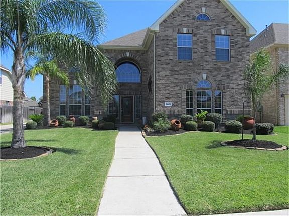 BEAUTIFUL KITCHEN WITH GRANITE COUNTERS, ISLAND, STAINLESS APPLIANCES, TILE BACK SPLASH, TILE FLOORING,LOTS OF CABINETS,WITH 1/2 BATH AND LAUNDRY ROOM JUST AROUND THE CORNER