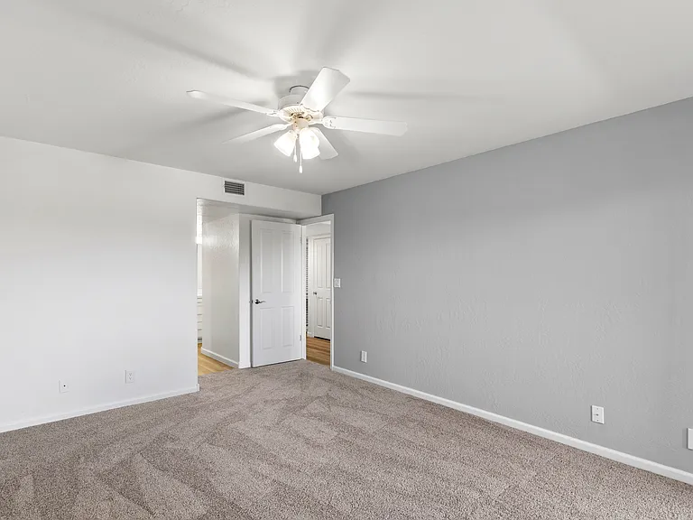 Master Bedroom with access to your spacious patio, Ceiling fans are always included. Large walk in closet
