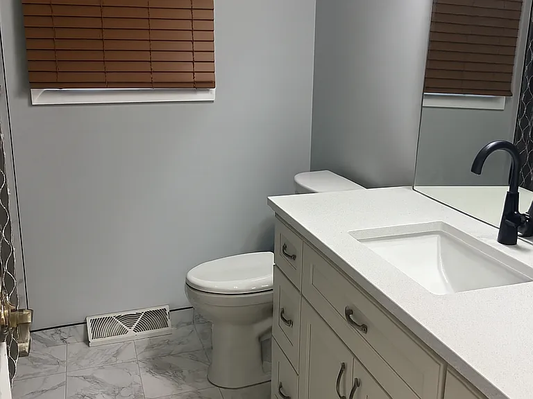 Newly remodeled bathroom - New vanity, bathtub/shower, tile throughout