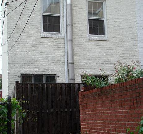 Back view with patio fence
