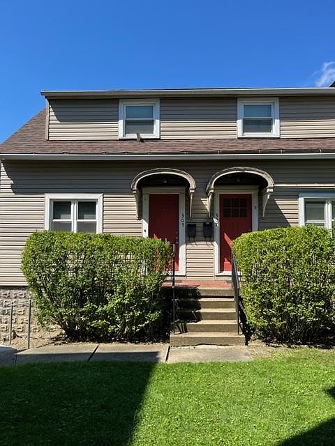Side-by-side duplex on rear of lot facing Harrison Ave, a block up from the Train Station.
