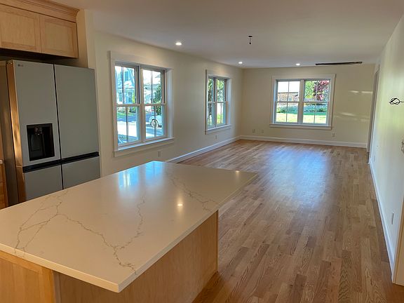 Open living room, dining room, and kitchen.
