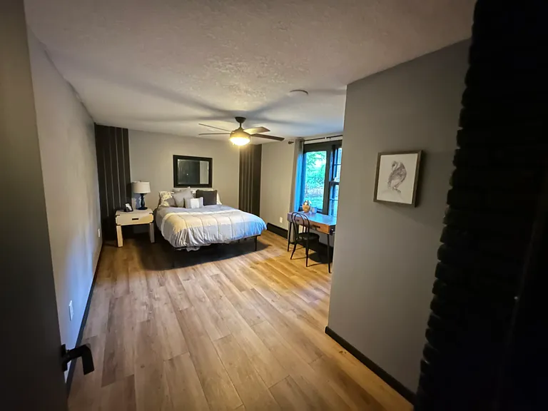 Downstairs bedroom offers comfortable living space.