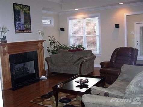 Spacious, light Living Room with Trey Ceiling and Fireplace