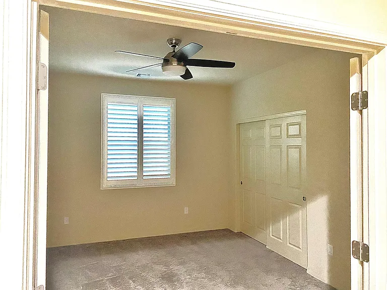 Bedroom 2, with double doors.