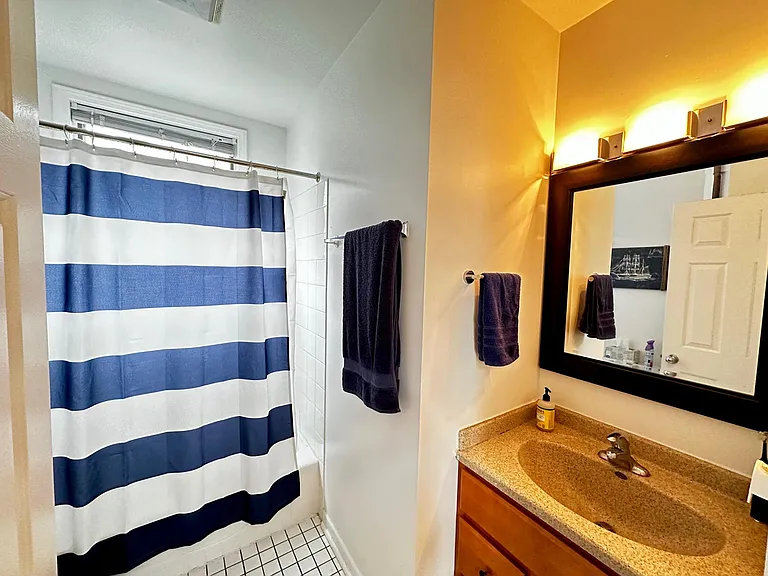 1ST LEVEL BATH WITH LIGHTED MAPLE VANITY WITH GRANITE TOP