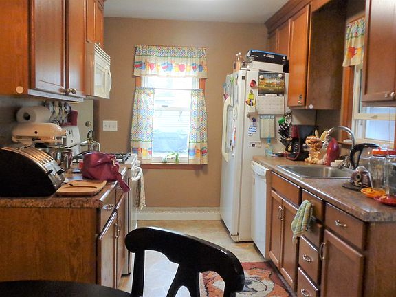Nice sunny kitchen, with the back door to the driveway for easy access to the car, and garage