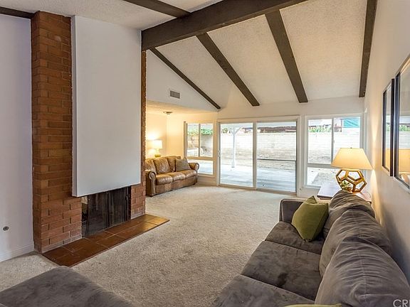 Living Room with LOTS of natural light. Wood beams