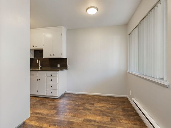 Cozy dining area with a glimpse into the kitchen