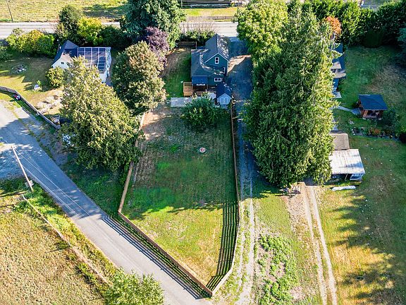 Overview of property. Driveway has two entrances and exits.
