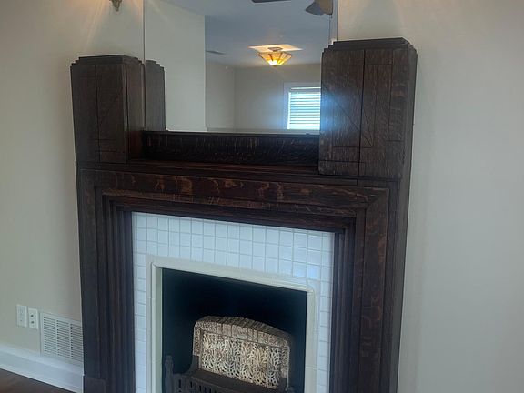 Functional gas heater, vintage tiger oak mantle.