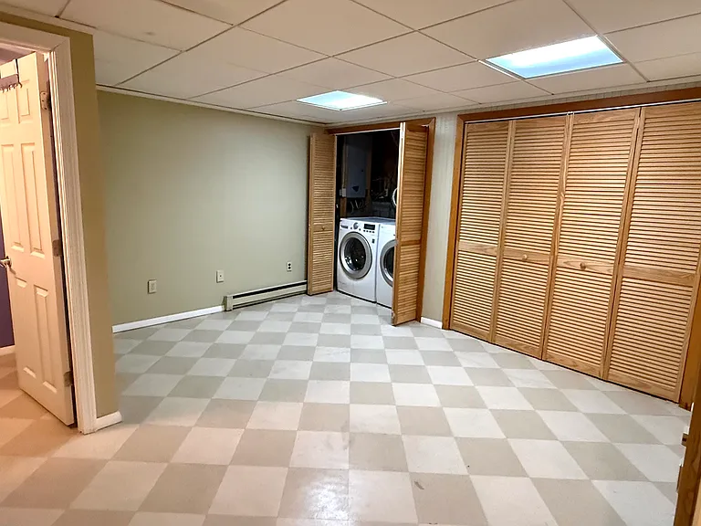 Lower-level flex-use space and hidden washer and dryer (included)