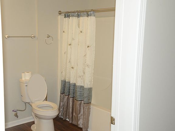 Toilet with shower/bathtub