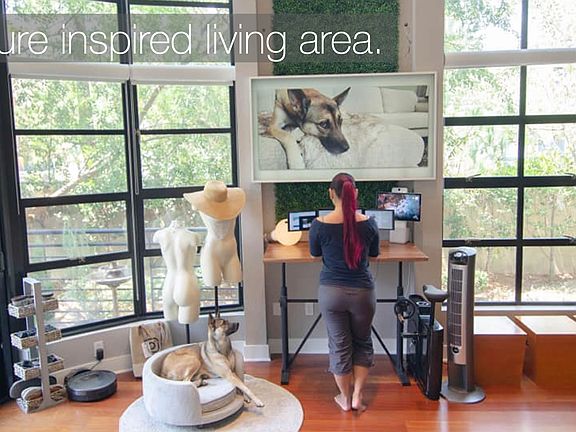 Two-story floor-to-ceiling windowsWorkstation with adjustable standing desk (if renting as furnished) with a Samsung Frame TV to blend in with decor