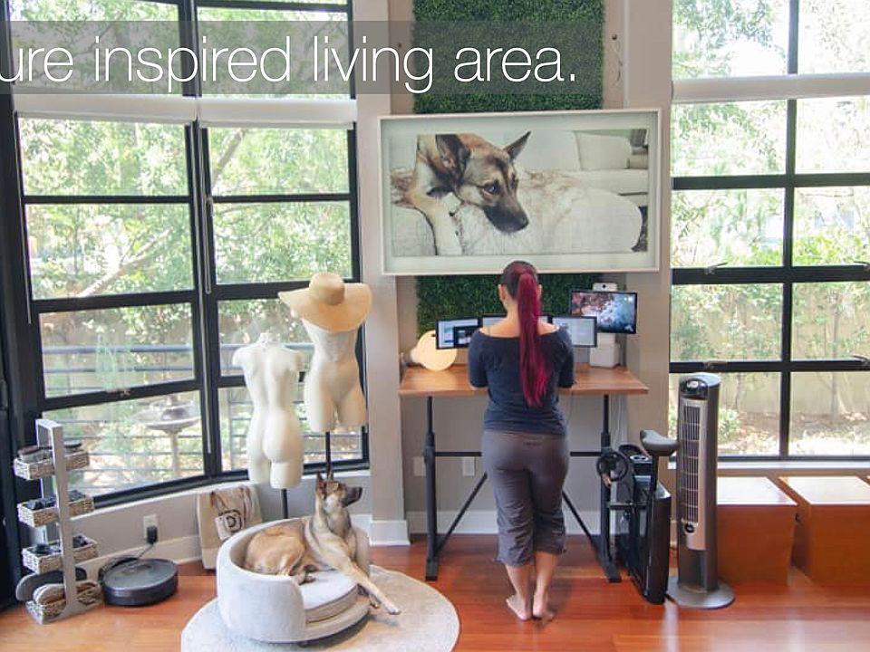 Two-story floor-to-ceiling windowsWorkstation with adjustable standing desk (if renting as furnished) with a Samsung Frame TV to blend in with decor