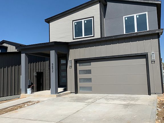 Front of home / main entrance / 2 car garage (with electric car charger)