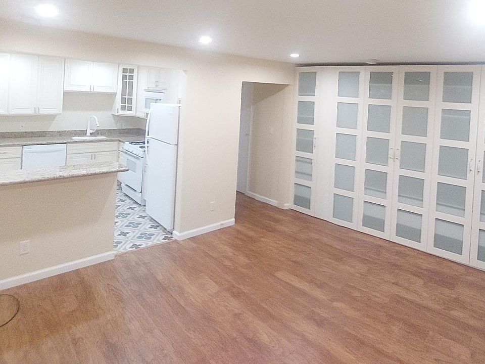 Living room and kitchen, hallway to bathroom