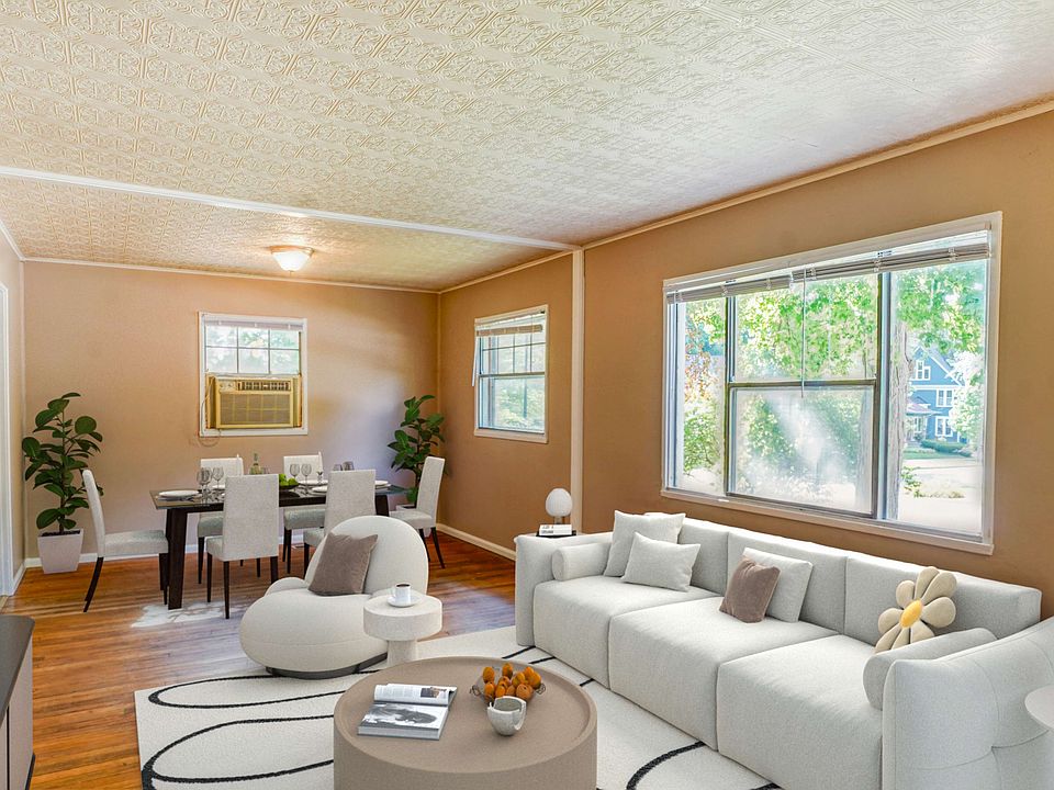 Spacious living room hard wood floors large windows