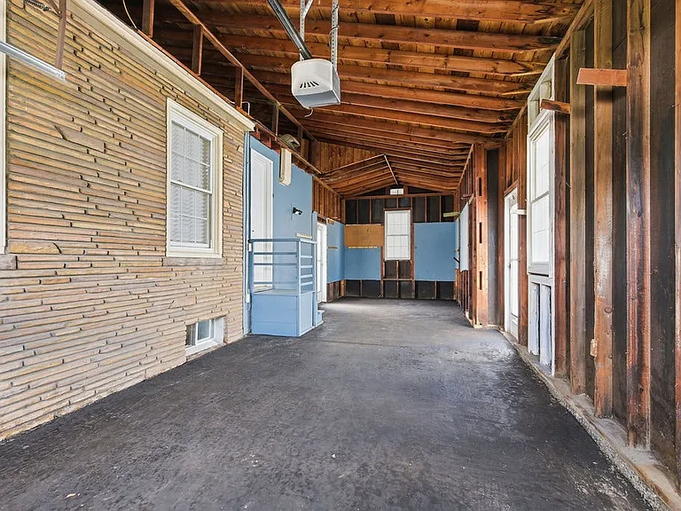 Attached one-car garage with space for parking.