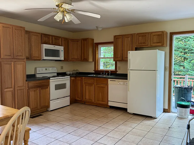 Full View of Kitchen and Door to Deck