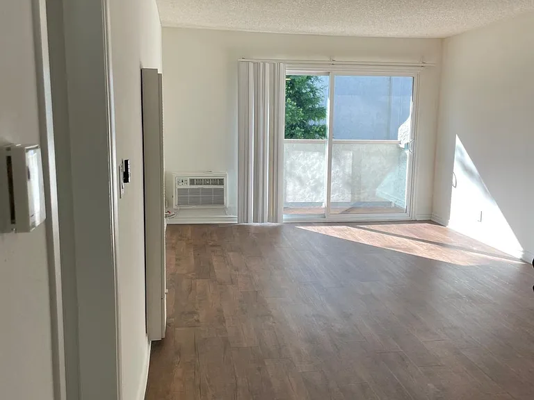 2bed+1bath Living and Dining area with AC wall unit and balcony.
--
*Floor plans are digital renderings. All dimensions are approximate. Actual product and specifications may vary in dimension or detail. Not all features are available in every apartment.