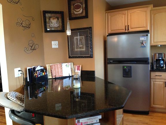 Sunny Kitchen with granite countertops and stainless appliances