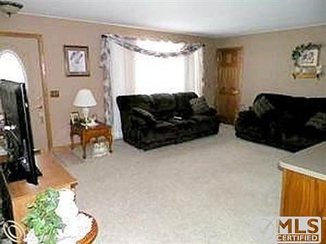 Spacious living room completes t