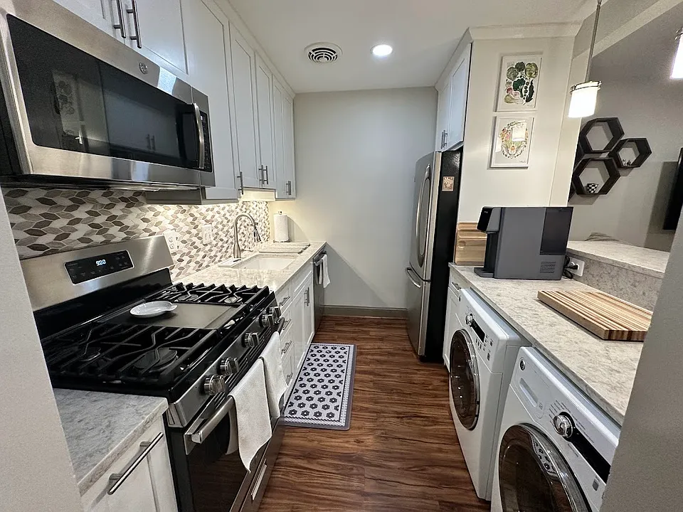 New appliances: microwave, gas stove-top, high-end dishawasher, refrigerator, and GE side-load washer & dryer.