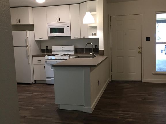 Kitchen and front door. Lots of light.