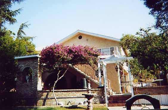 Back of the house view standing in the backyard
