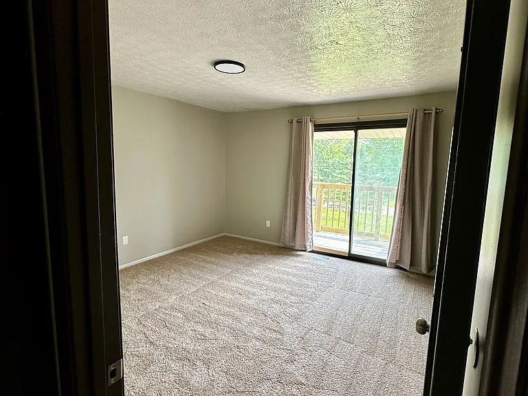Second-Floor Primary Bedroom with Balcony