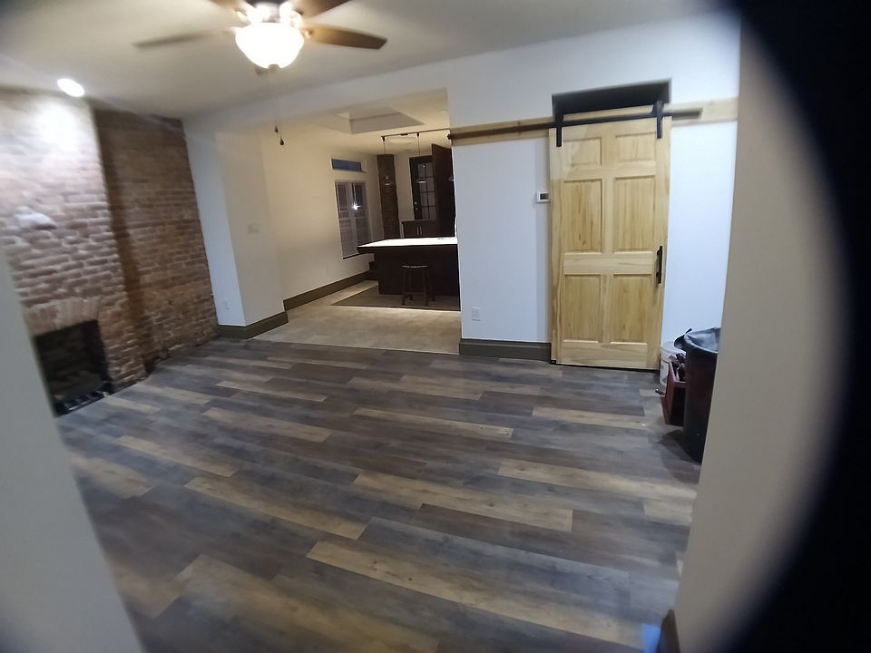 View of Living room/kitchen at far left,door at rightt to laundry room & 2nd bathroom