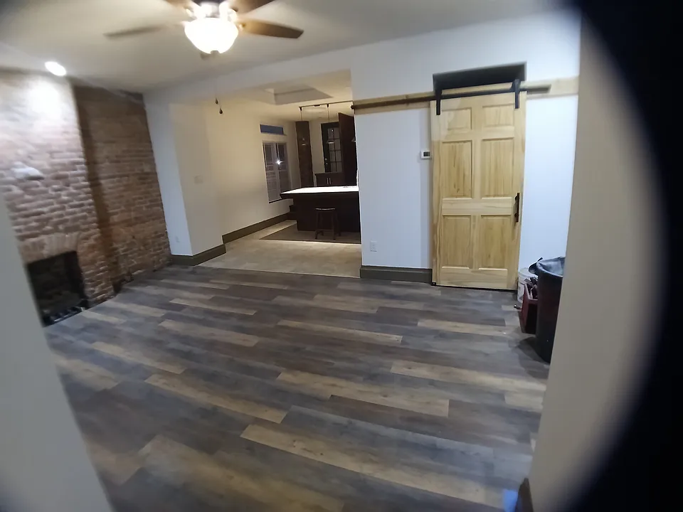 View of Living room/kitchen at far left,door at rightt to laundry room & 2nd bathroom