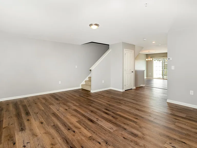Living room with kitchen and dining behind