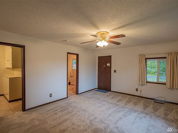 Living room has insulated windows, new paint and carpeting!