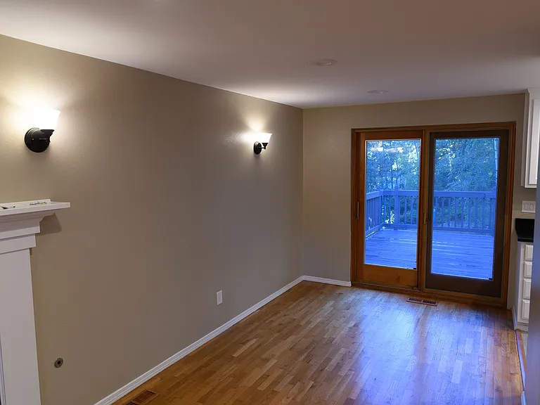 Dining area with doors out onto the deck. Lots of light!