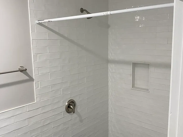 Large walk-in shower with bench