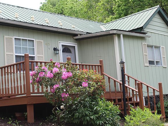 Front view of home. Lamp post - electrical outlet for outdoor decorations.